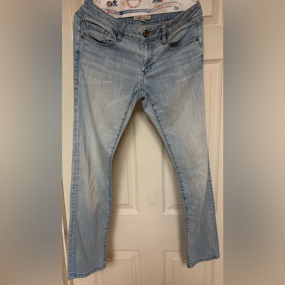 Women’s CAbi light wash jeans. Inseam 28”, rise 7.5”. Size 2